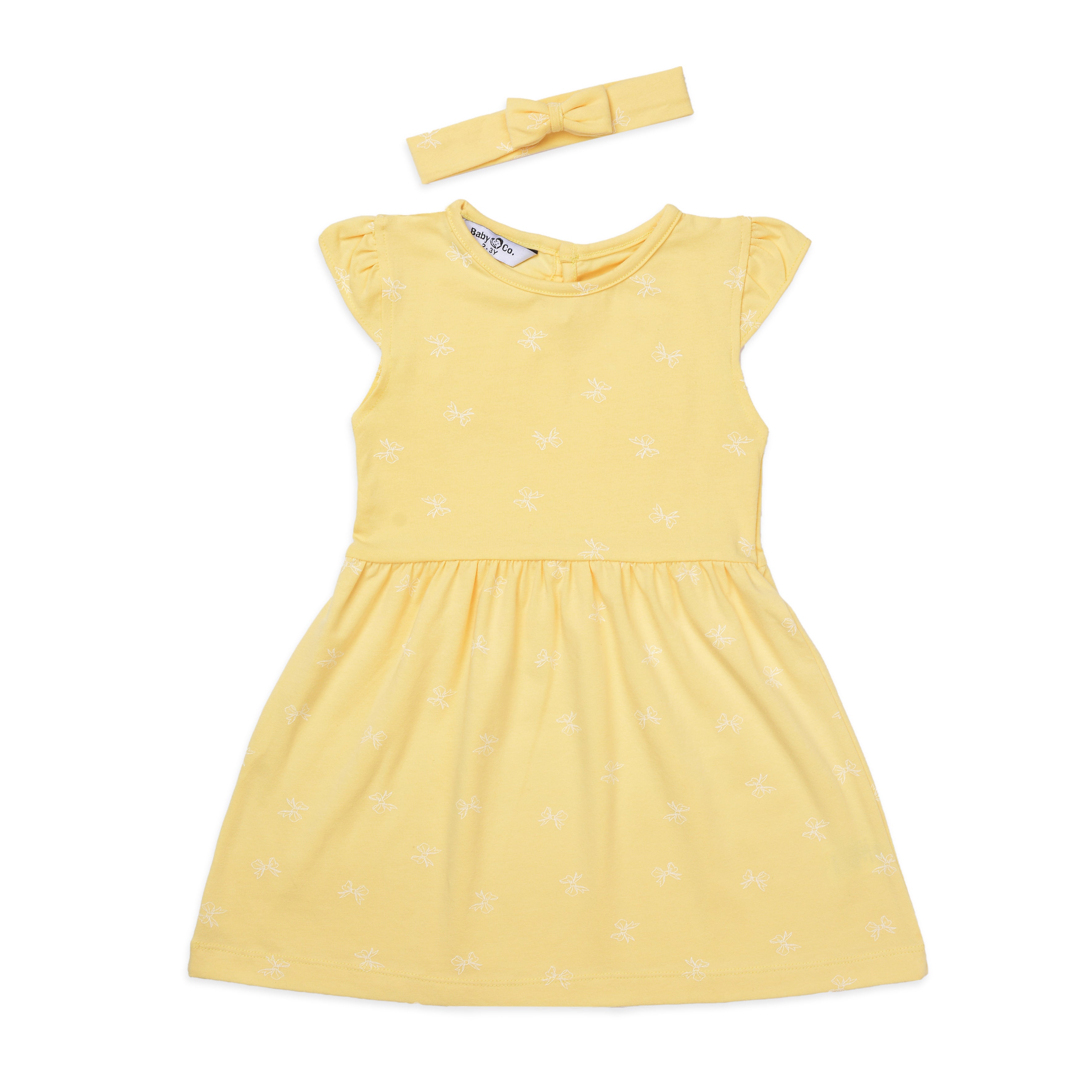 فستان أصفر مطبوع مع رباط رأس